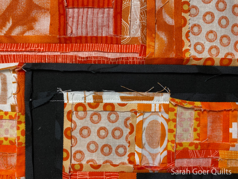 https://sarahgoerquilts.com/wp-content/uploads/2020/12/Orange-Improv-Log-Cabin-Mini-Quilt-bulk-in-seam3.jpg