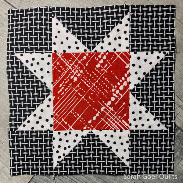 https://sarahgoerquilts.com/wp-content/uploads/2020/12/red-improv-log-cabin-mini-quilt-center-block.jpg